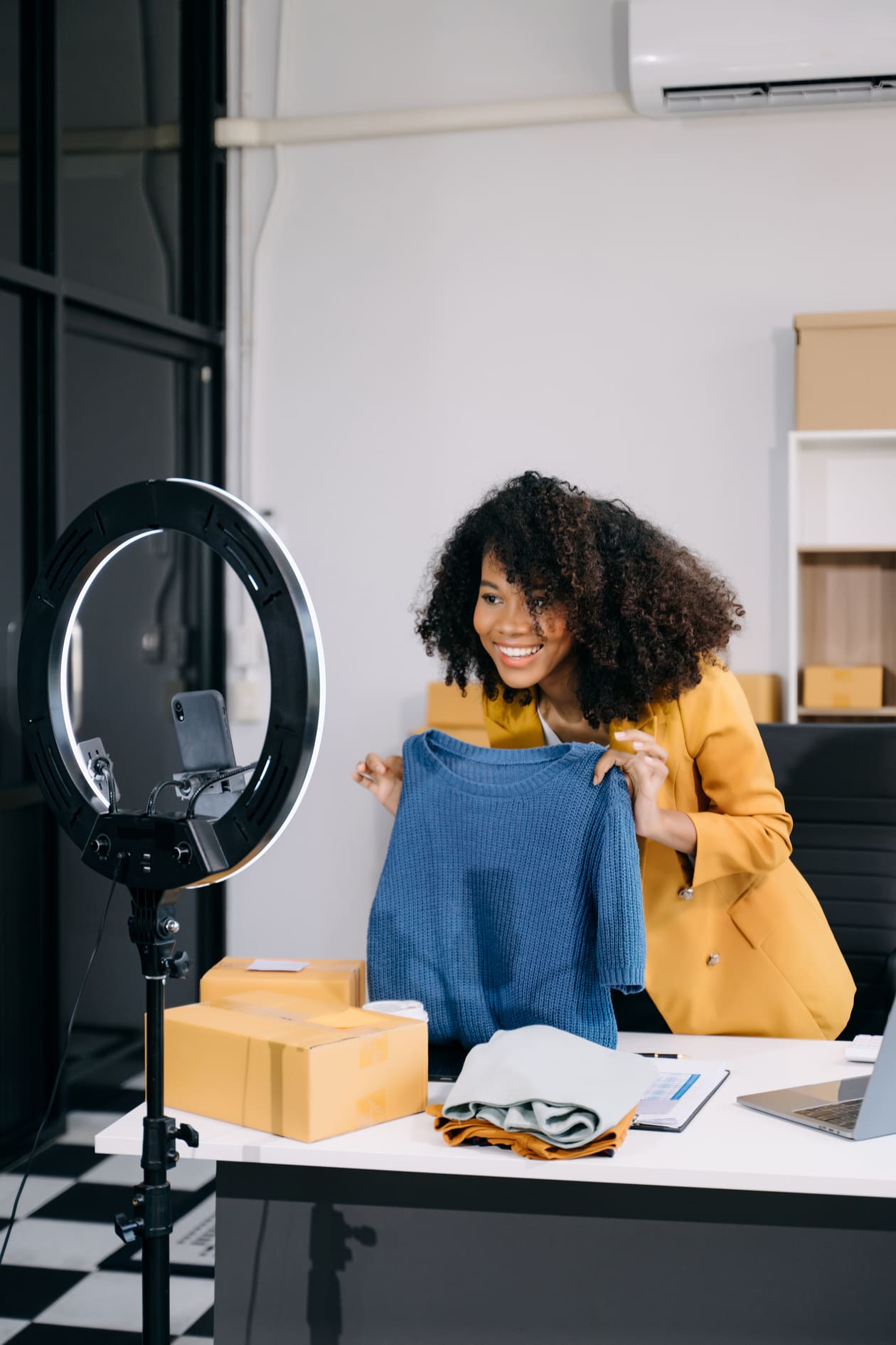 Fashion creator presenting a garment on camera